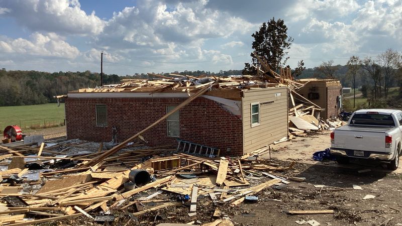 Brick home and debris after an EF2 tornado in Hughes Springs, Texas