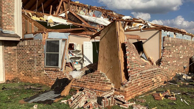 Brick home torn open by an EF2 tornado in Hughes Springs, Texas