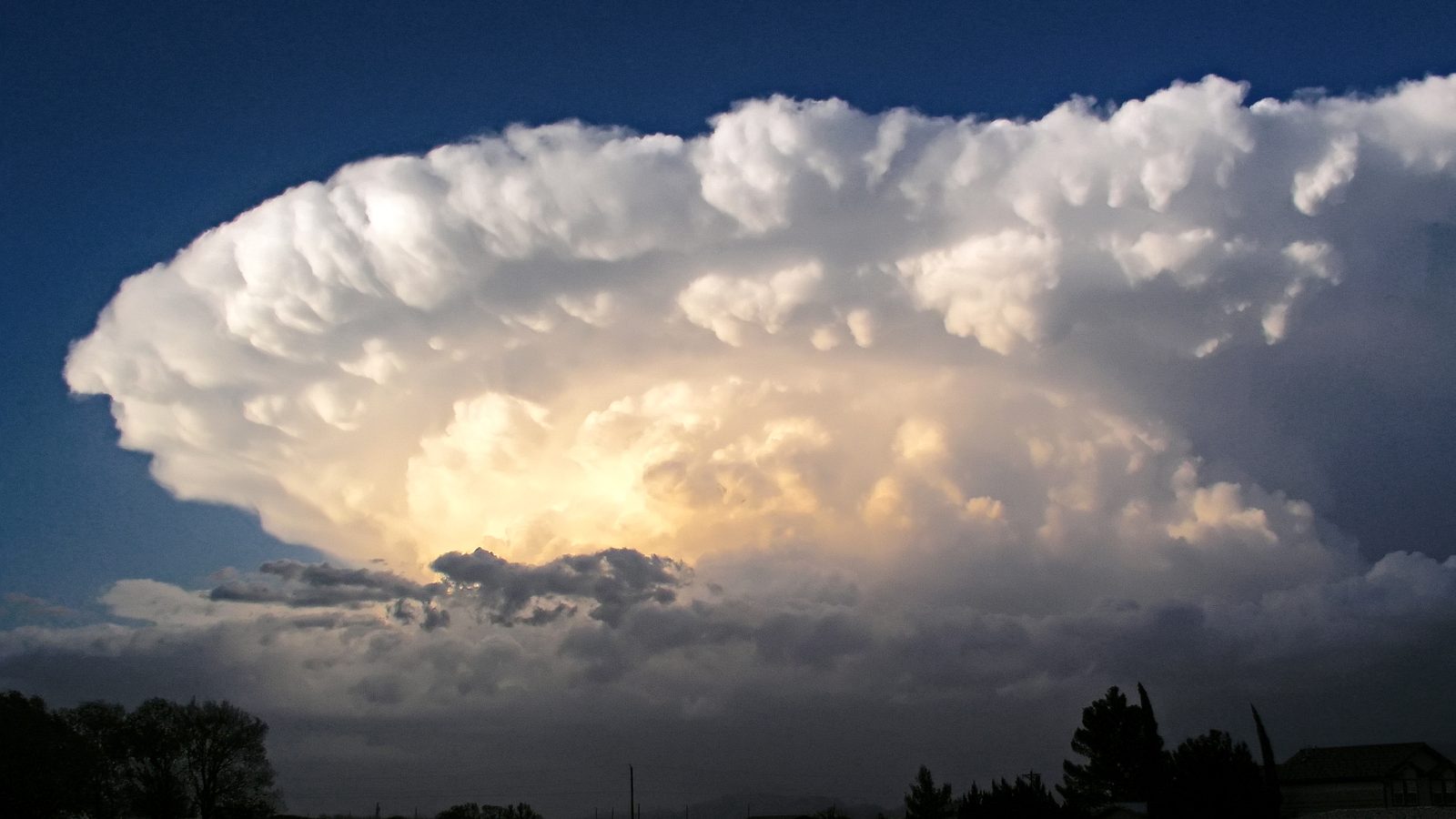 Towering supercell thunderstorm at dusk