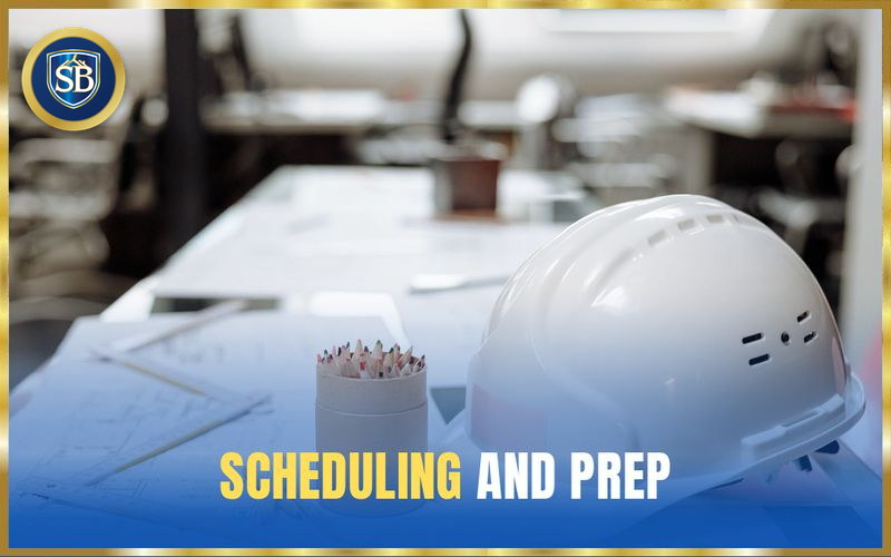 White hard hat resting on project plans on the planning table — scheduling and prep
