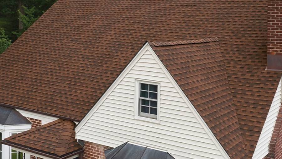 A finished roof in GAF Timberline HDZ Hickory on a home